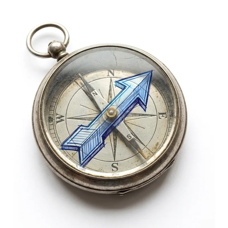A compass with a single hand-drawn arrow pointing one clear direction