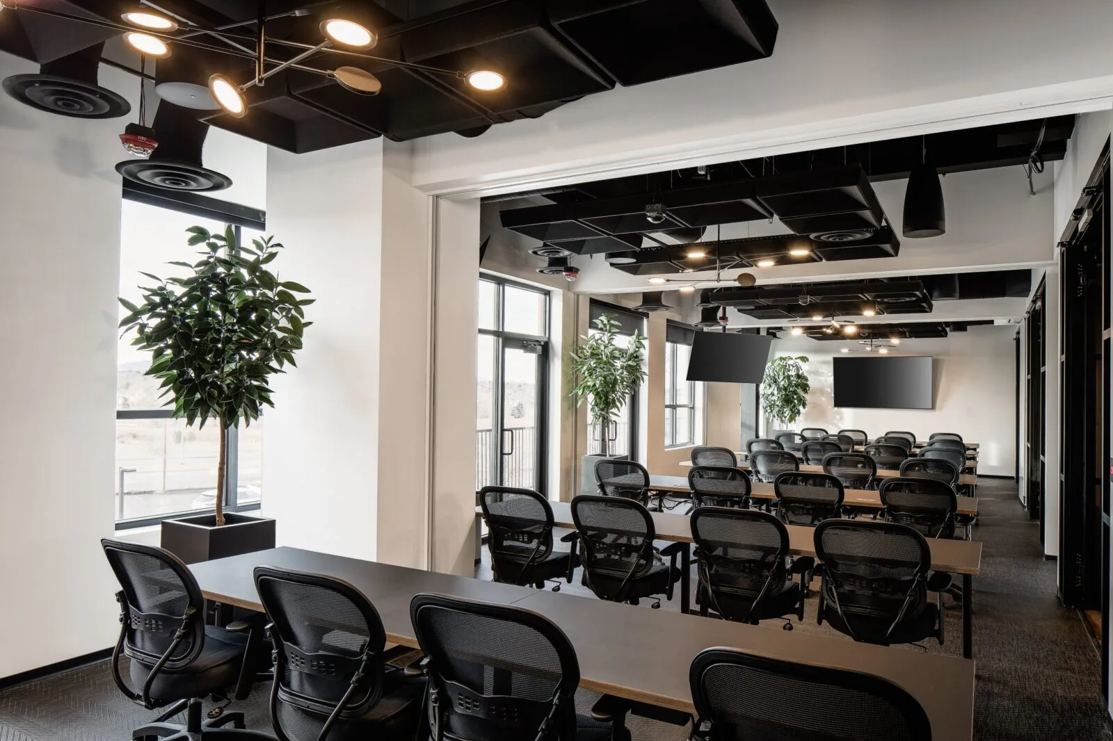 Ascent training room at Shift Office Spaces, Littleton - rows of desks and chairs, screens, and a mountain view